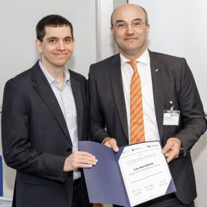 Lior Kornblum receiving the 33rd Umbrella Award from Prof. Dr. Ulrich Rüdiger, Rector of RWTH Aachen